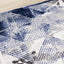 Chorus Grey Blue White Distressed Triangle Grid Rug by Kalora Interiors